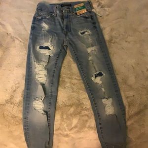 ripped blue jeans never worn